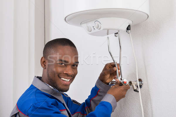 Plumber Repairing Electric Boiler Stock photo © AndreyPopov