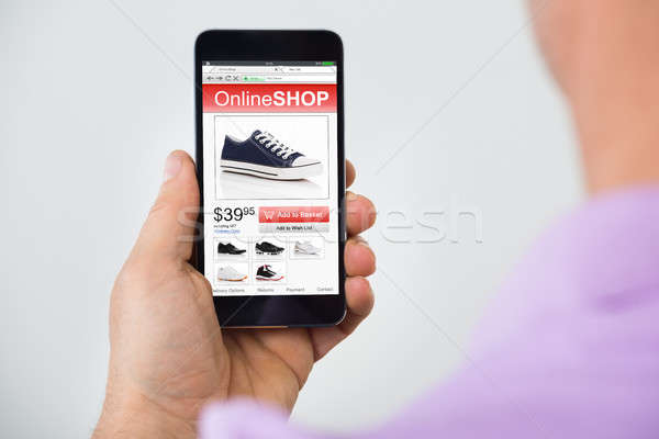 Person Shopping Online On Mobilephone Stock photo © AndreyPopov