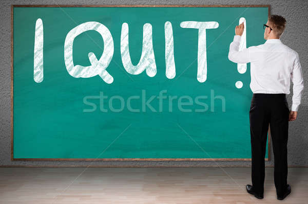 Businessman Writing I Quit On Blackboard Stock photo © AndreyPopov