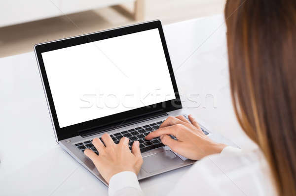 Businesswoman Working On Laptop Stock photo © AndreyPopov