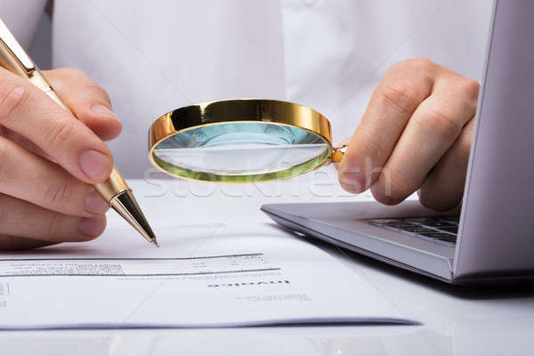 Auditor Inspecting Financial Documents Stock photo © AndreyPopov