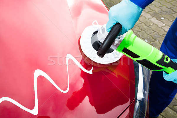 Person's Hand Polishing Car Hood Stock photo © AndreyPopov