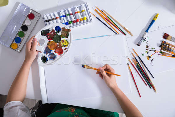Elevated View Of Artist Painting On Canvas Paper Stock photo © AndreyPopov