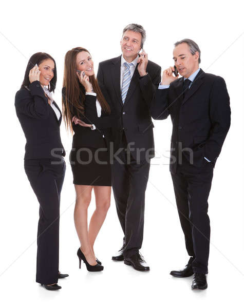 Group Of Businesspeople Gossiping Stock photo © AndreyPopov