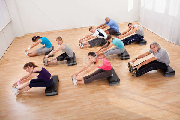 People doing stretching exercises Stock photo © AndreyPopov