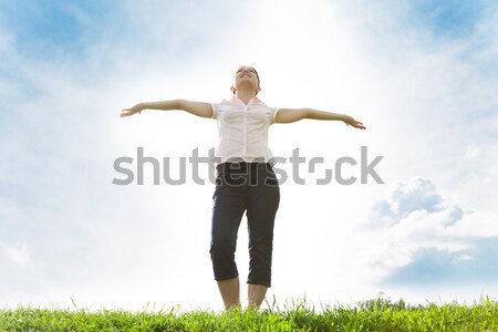 Young Woman With Her Arms Outstretched Stock photo © AndreyPopov