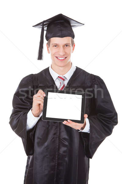Man In Graduation Robe Showing Tablet Pc Stock photo © AndreyPopov