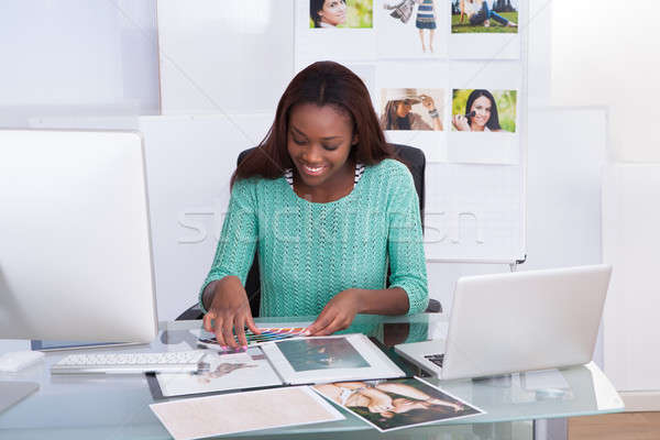 Photo Editor Working At Office Desk Stock photo © AndreyPopov