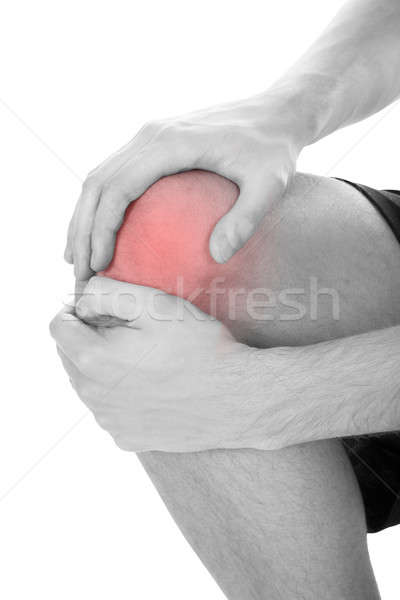 Hombre rodilla lesión primer plano sufrimiento blanco Foto stock © AndreyPopov