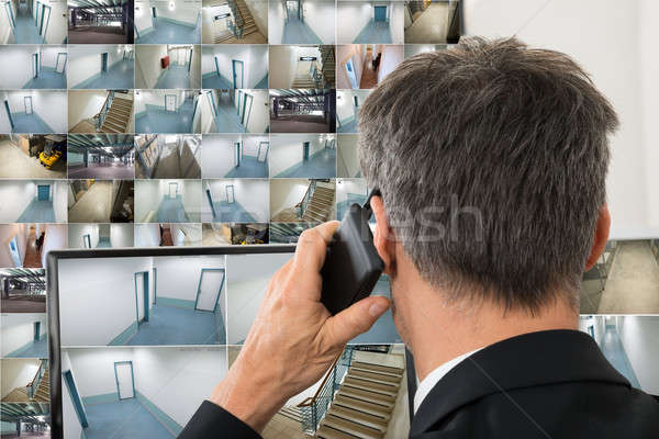Security System Operator Looking At Cctv Footage Stock photo © AndreyPopov