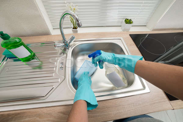 Person Hands Cleaning Kitchen Sink Stock photo © AndreyPopov