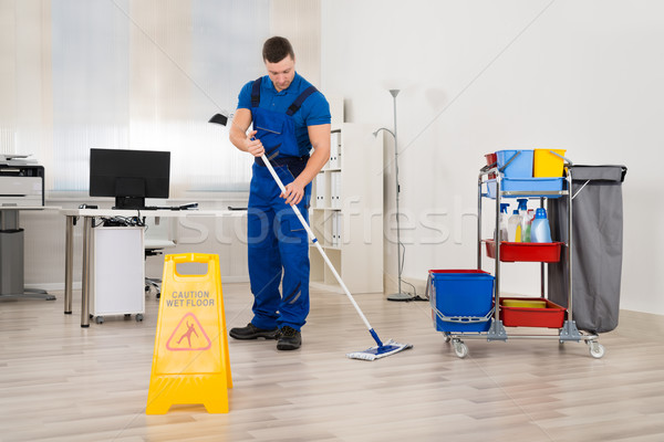 Janitor Mopping Floor In Office Stock photo © AndreyPopov