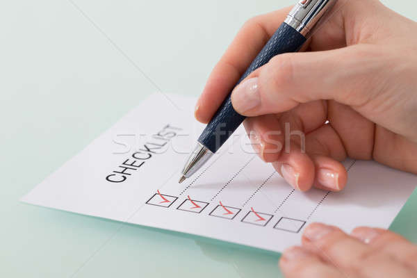 Woman Marking On Checklist Form With Red Pen Stock photo © AndreyPopov
