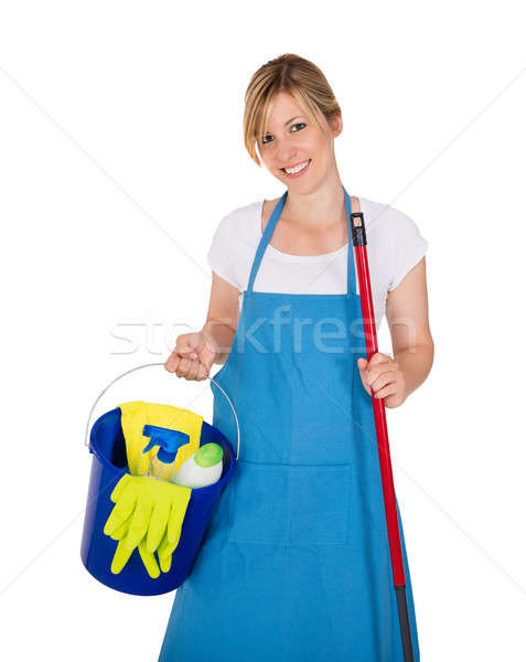 Stock photo: Young Happy Female Janitor With Cleaning Equipments