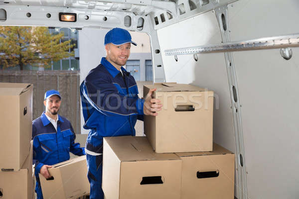 Mover Unloading Cardboard Box From Truck Stock photo © AndreyPopov