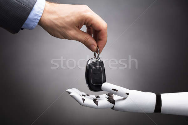 Businessperson Giving Car Key To Robot Stock photo © AndreyPopov