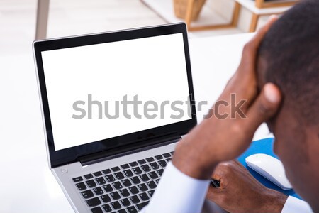 Stresszes üzletember laptopot használ magasról fotózva kilátás néz Stock fotó © AndreyPopov
