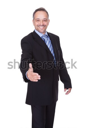 Stock photo: Portrait Of A Businessman Offering Handshake