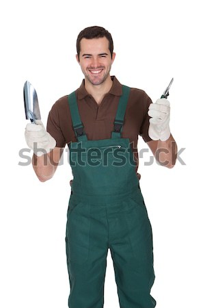 Stock photo: Happy young gardener in dungarees