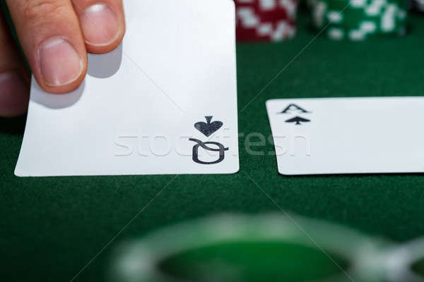 Croupier arranging cards Stock photo © AndreyPopov