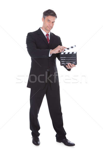 Businessman Holding Clapperboard Stock photo © AndreyPopov