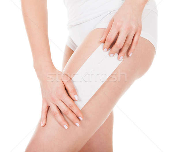 Woman Waxing Her Leg Stock photo © AndreyPopov