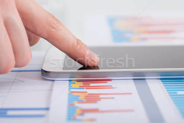 Businessman Analyzing Bargraph At Desk Stock photo © AndreyPopov