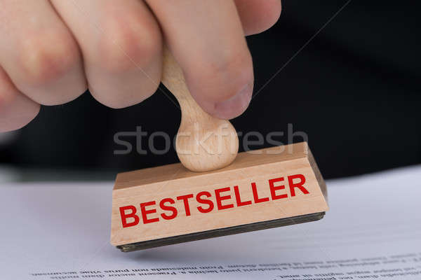 Hand Stamping Document With Bestseller Rubber Stamp Stock photo © AndreyPopov