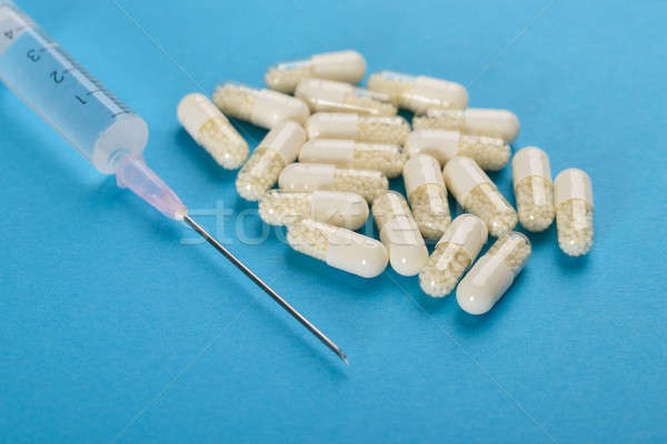 Close-up Of Syringe With Capsules Stock photo © AndreyPopov