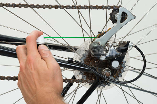 Person Hands Lubricating Bike Stock photo © AndreyPopov