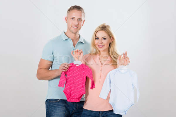 Expecting Couple With Baby Clothing Stock photo © AndreyPopov