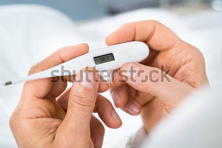 Woman Checking Blood Sugar Level Stock photo © AndreyPopov