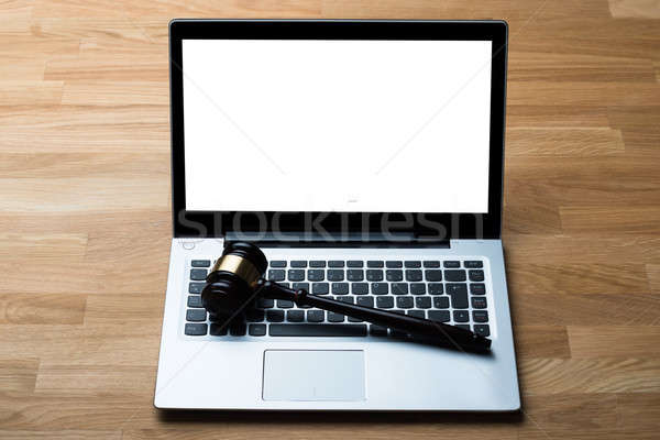 Laptop And Mallet On Table In Courthouse Stock photo © AndreyPopov