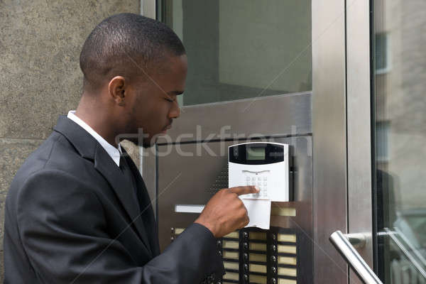Businessman Entering Code In Security System Stock photo © AndreyPopov