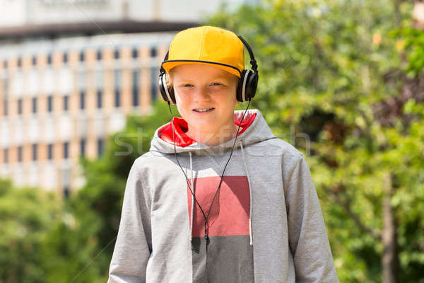 Smiling Boy Listening To Music Stock photo © AndreyPopov