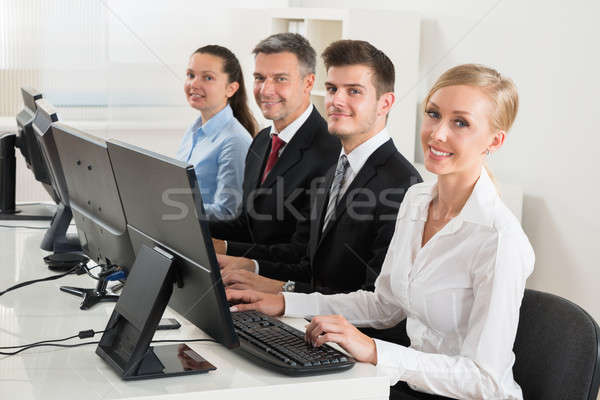 Businesspeople Typing On Desktop Computer Stock photo © AndreyPopov