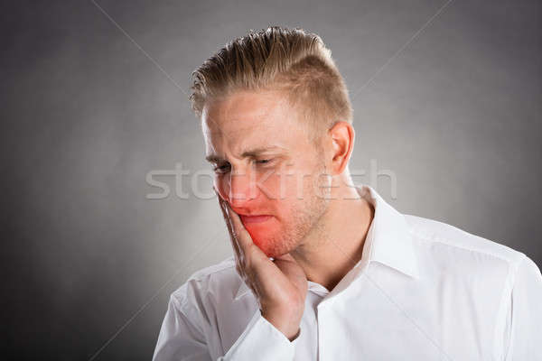 Young Man Suffering From Tooth Ache  Stock photo © AndreyPopov