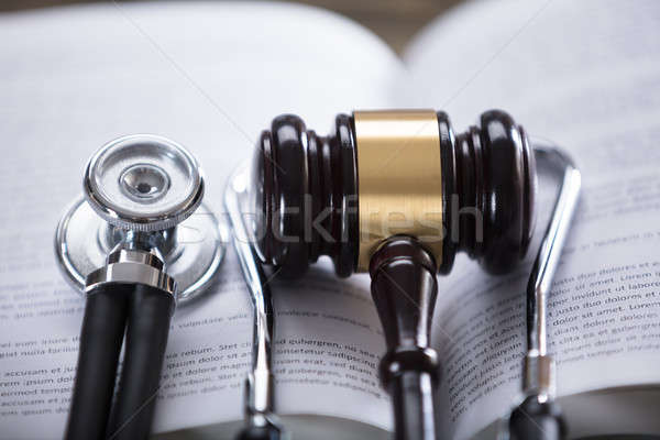 Stetoskop tokmak açmak hukuk kitap Stok fotoğraf © AndreyPopov