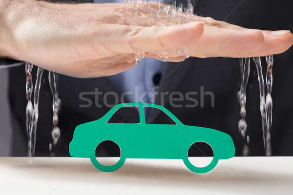 Hand Protecting The Green Car From Water Stock photo © AndreyPopov