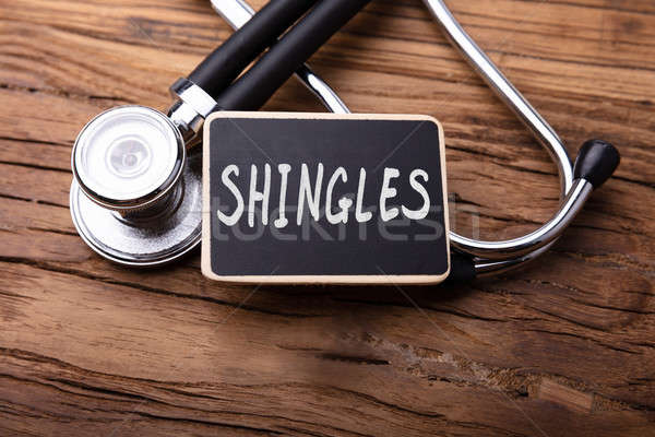 Shingles Word With Stethoscope On Wooden Table Stock photo © AndreyPopov