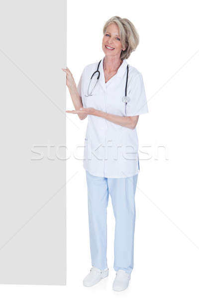 Female Doctor Holding Placard Stock photo © AndreyPopov