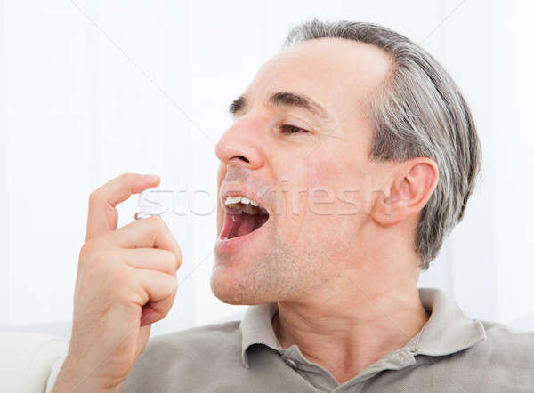 Man applying Fresh breath spray Stock photo © AndreyPopov