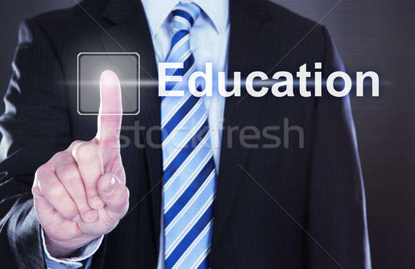 Businessman Pressing Education Button Stock photo © AndreyPopov