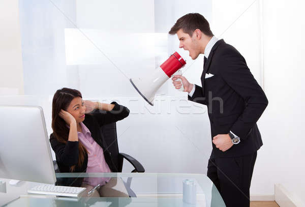 Businessman Scolding Businesswoman Stock photo © AndreyPopov