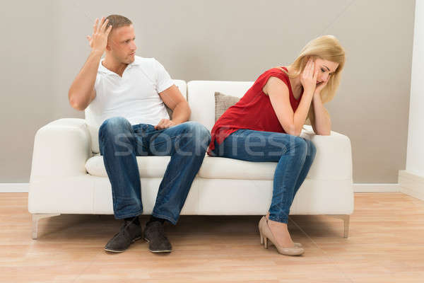 Deprimido Pareja sesión sofá casa Foto stock © AndreyPopov