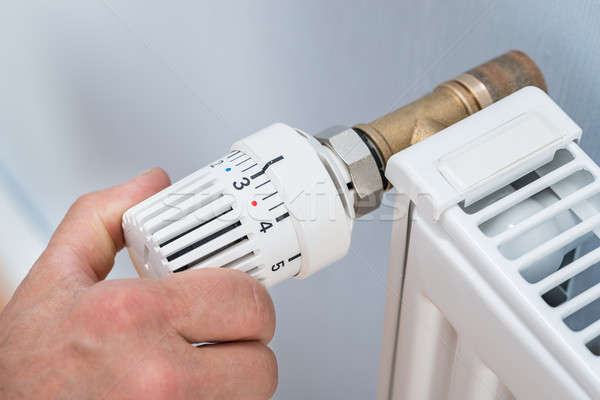 Stock foto: Person · Temperatur · Heizkörper · Thermostat · Personen