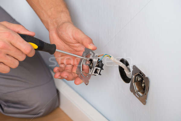 Electrician Hands Installing Wall Socket Stock photo © AndreyPopov