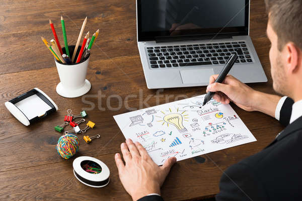 Close-up Of Businessman Drawing Diagram Of Start-up Plan Stock photo © AndreyPopov