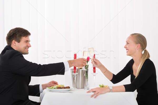 Couple Toasting Glass Of Champagne Stock photo © AndreyPopov