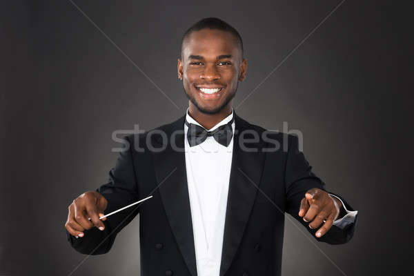 Portrait Of Music Conductor With Baton Stock photo © AndreyPopov